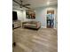 Cozy living room with modern ceiling fan, wood floors, and open view to dining area at 172 Scarsdale Dr, Riverdale, GA 30274