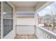Outdoor balcony view featuring white railings and overlooking the neighborhood at 6336 Lake Valley Pt, Lithonia, GA 30058