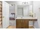 Bathroom with a single sink vanity and a view into the connected bedroom at 6336 Lake Valley Pt, Lithonia, GA 30058
