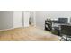 Bedroom featuring neutral carpet, light gray walls, white trim, and an adaptable workspace, perfect for comfort and productivity at 6336 Lake Valley Pt, Lithonia, GA 30058