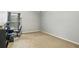 A carpeted room with a desk, chair, and good natural light at 6336 Lake Valley Pt, Lithonia, GA 30058