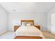 Bright bedroom with a large bed, matching nightstands, and neutral decor at 6336 Lake Valley Pt, Lithonia, GA 30058