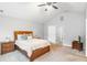 Bedroom with vaulted ceilings and a plush bed, illuminated by natural light at 6336 Lake Valley Pt, Lithonia, GA 30058