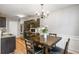 A modern kitchen with granite countertops, stainless steel appliances, and dark wood cabinetry at 6336 Lake Valley Pt, Lithonia, GA 30058