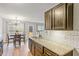 Kitchen area boasts granite countertops, stainless appliances, and a cozy dining space at 6336 Lake Valley Pt, Lithonia, GA 30058