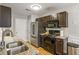 Updated kitchen showcasing granite countertops, stainless appliances, and ample cabinet space at 6336 Lake Valley Pt, Lithonia, GA 30058