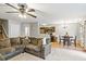 Cozy living room with an open layout to the kitchen and dining area and plush sofa at 6336 Lake Valley Pt, Lithonia, GA 30058