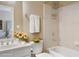 Bright bathroom featuring a shower and tub combo, white tile surround, and neutral walls with floral accents at 3162 Abbey Sw Dr, Atlanta, GA 30331
