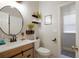 This half bathroom features modern fixtures, rustic wood accents, and stylish decor at 3162 Abbey Sw Dr, Atlanta, GA 30331
