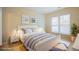 Bright bedroom with white bed frame, neutral walls, and a large window that provides plenty of natural light at 3162 Abbey Sw Dr, Atlanta, GA 30331