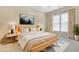 Light filled bedroom with natural wood bedframe, neutral walls, and a large window with decorative drapes at 3162 Abbey Sw Dr, Atlanta, GA 30331