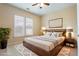 A cozy bedroom features a large window, decorative rug, and coordinated decor at 3162 Abbey Sw Dr, Atlanta, GA 30331