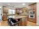 Well-appointed kitchen featuring granite countertops, stainless steel appliances, and breakfast bar at 3162 Abbey Sw Dr, Atlanta, GA 30331