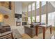 Sunlit living room featuring soaring ceilings, fireplace, and large windows at 3162 Abbey Sw Dr, Atlanta, GA 30331