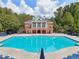 Stunning community pool with brick pool house and lounge chairs offers a resort-like feel at 3162 Abbey Sw Dr, Atlanta, GA 30331