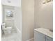 Bathroom with tile floors, toilet, and sink with vanity at 3339 Brenda Ln, Lithia Springs, GA 30122