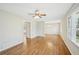 Bright living room featuring hardwood floors, large windows, and a ceiling fan at 3339 Brenda Ln, Lithia Springs, GA 30122