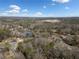 Wide aerial view of a beautiful neighborhood with homes surrounded by mature trees and a nearby lake at 206 Foothill Dr, Woodstock, GA 30188