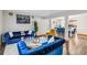 Open living area with white walls, hardwood floors, and adjoined to a cozy dining area at 4022 Rosebud Park Dr, Snellville, GA 30039