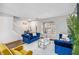 Inviting living area with plush white rug, blue velvet furniture and natural light at 4022 Rosebud Park Dr, Snellville, GA 30039