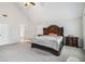 The main bedroom features a sizable bed with a vaulted ceiling, offering comfort and style at 4022 Rosebud Park Dr, Snellville, GA 30039