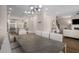 Bright, open-concept dining area featuring modern lighting and a marble-top table adjacent to the kitchen at 1944 Westside Nw Blvd, Atlanta, GA 30318