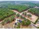 An elevated view displaying the home's large lot, mature trees, neighboring properties, and quiet residential streets at 2705 Luke Edwards Rd, Dacula, GA 30019
