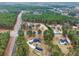 Expansive aerial view of the property showcasing its wooded surroundings and neighborhood in a tranquil, rural setting at 2705 Luke Edwards Rd, Dacula, GA 30019