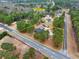 Aerial shot outlining property lines of a home in a wooded area next to a road at 2705 Luke Edwards Rd, Dacula, GA 30019