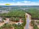 Beautiful aerial view of property surrounded by lush greenery and near Harbins Park at 2705 Luke Edwards Rd, Dacula, GA 30019