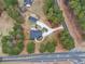 Bird's eye view of the home showcasing its long driveway, landscaping and proximity to paved roads and greenery at 2705 Luke Edwards Rd, Dacula, GA 30019
