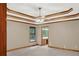 Spacious bedroom with tray ceiling, ceiling fan, and ensuite bathroom access at 2705 Luke Edwards Rd, Dacula, GA 30019