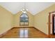 Spacious dining room with hardwood floors, high ceilings, and bright window at 2705 Luke Edwards Rd, Dacula, GA 30019