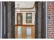 Elegant foyer featuring hardwood floors, detailed trim, and front door with a view through to the living room at 2705 Luke Edwards Rd, Dacula, GA 30019