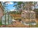 Backyard with two greenhouses and custom-built raised garden beds at 2705 Luke Edwards Rd, Dacula, GA 30019