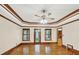 Bright living room with hardwood floors, trey ceiling, and multiple windows at 2705 Luke Edwards Rd, Dacula, GA 30019