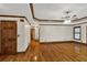 Open living room featuring hardwood floors, ceiling fan, and natural light at 2705 Luke Edwards Rd, Dacula, GA 30019