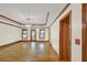 Open living room featuring hardwood floors, ceiling fan, and natural light at 2705 Luke Edwards Rd, Dacula, GA 30019
