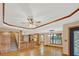 Open floor plan showcasing the kitchen, living room, and staircase with hardwood floors at 2705 Luke Edwards Rd, Dacula, GA 30019