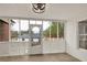 Screened-in porch featuring white lattice panels and a view of the backyard at 2705 Luke Edwards Rd, Dacula, GA 30019