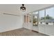 Screened-in porch featuring white lattice panels and a view of the backyard at 2705 Luke Edwards Rd, Dacula, GA 30019