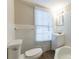 Classic bathroom with window, toilet, tub, and single sink vanity at 2800 Kingston Ter, Atlanta, GA 30344