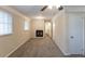 Bedroom with neutral walls, carpeted floors, a ceiling fan, fireplace and two windows with blinds at 2800 Kingston Ter, Atlanta, GA 30344