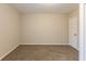 The bedroom is finished with neutral walls and soft neutral carpeting at 2800 Kingston Ter, Atlanta, GA 30344
