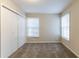 Bedroom with neutral walls, two windows, carpet and double closet at 2800 Kingston Ter, Atlanta, GA 30344