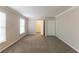 Bedroom featuring neutral walls, carpeted floors, and two windows with white blinds at 2800 Kingston Ter, Atlanta, GA 30344