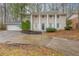Charming two-story home with a classic facade, a large driveway, and a well-manicured lawn at 2800 Kingston Ter, Atlanta, GA 30344