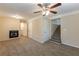 Cozy living room featuring carpeted floors, a fireplace, and access to stairs and other rooms at 2800 Kingston Ter, Atlanta, GA 30344