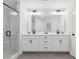 A newly renovated bathroom with double vanity, shower, and white cabinets at 2980 Ferrington Way, Smyrna, GA 30080