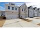 Home exteriors with neutral color schemes, two-car garages and modern design at 2980 Ferrington Way, Smyrna, GA 30080